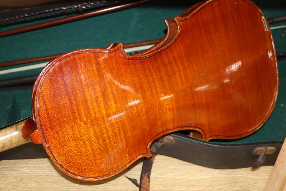 A 20th century Antonius Stradivarius Cremonensis violin, cased with two bows